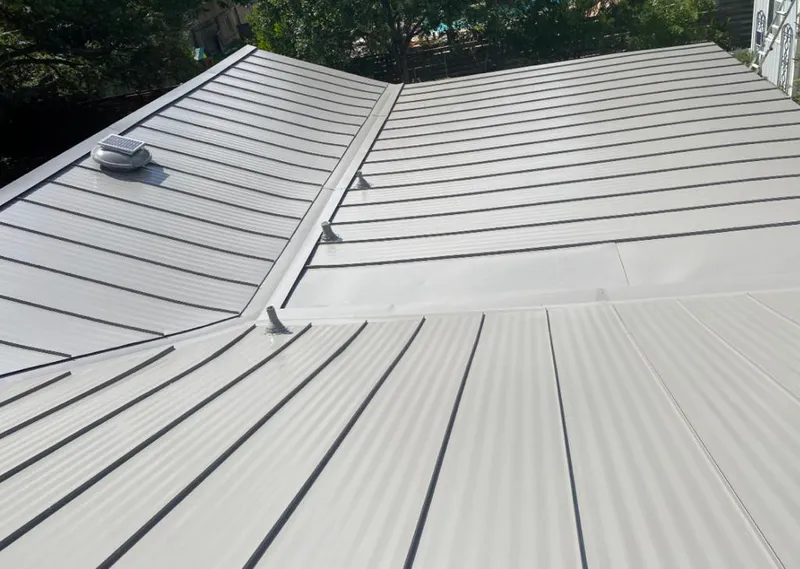Solar attic fan installed on a metal roof for Roof Ventilation in Dickson City